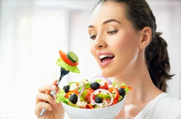 A woman eating salad