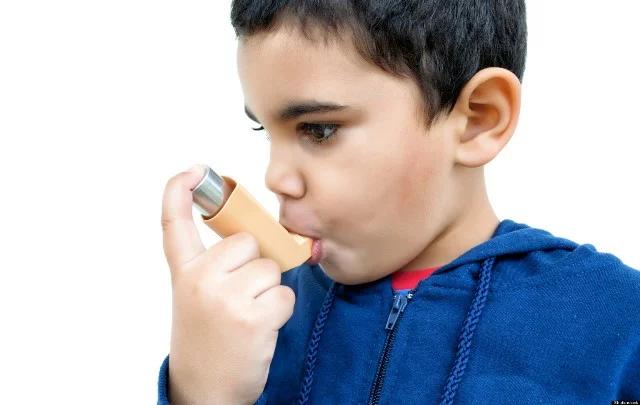 Hispanic boy suffering an asthma attack