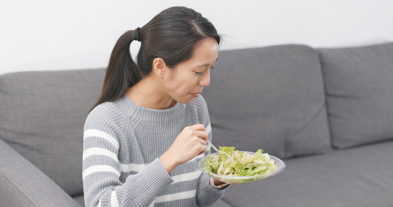 Girl eating a salad