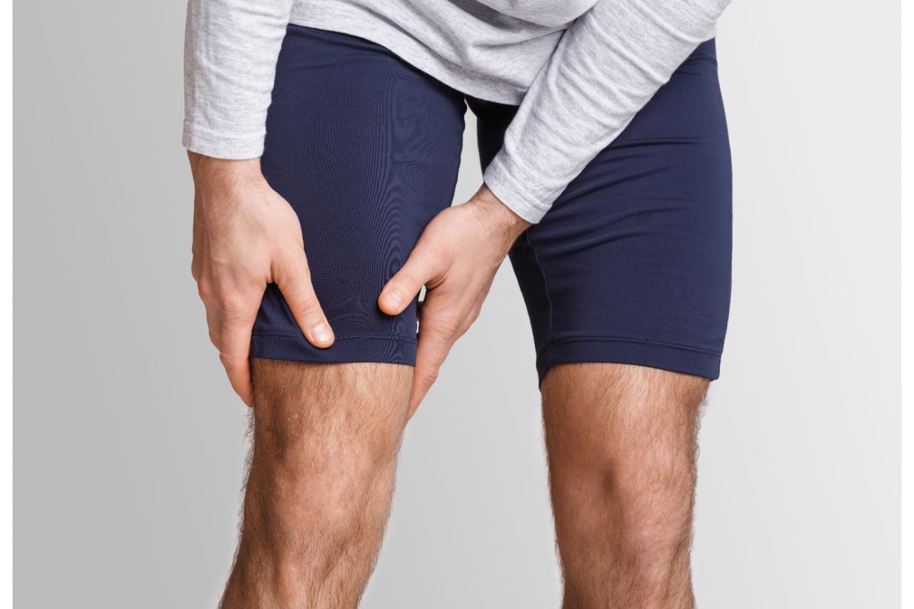 Man with aching thigh